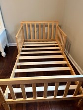 Never Used Brown Toddler Bed fit for crib size mattress. Dimensions: 53x30x23
