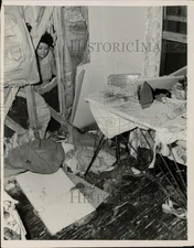 1953 Press Photo Sally Swift looks over her Chicago home hit by a crashed plane