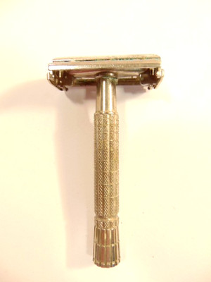 older steel colored Gillette safety razor with date marks ''E'' & ''1'' on head