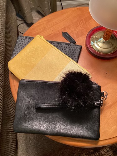 Express black wrislet. Ipsy makeup bags  one black and one yellow. Price isfor 3