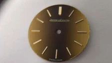 Jaeger Lecoultre DIAL 19069 ROUND Gold/Brown approx 20mm diameter, feet at 5 o'c