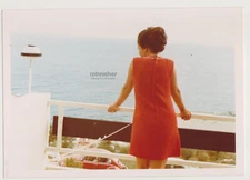 Pretty Young Woman Lady in Red A Mystical Gaze Over the Endless Blue Horizon