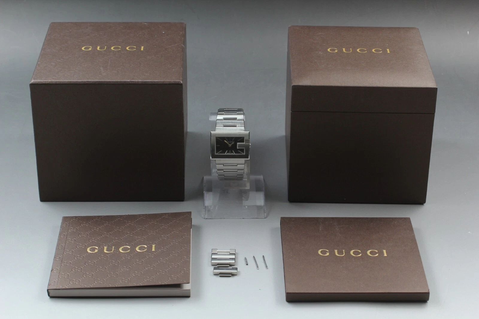 Montre femme GUCCI G rectangle 100L cadran noir quartz boîte et papiers