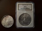 5) Silver Eagles 1-1986 NGC MS69, 1-2009 SE w/some toning at top & 3-1991  SE
