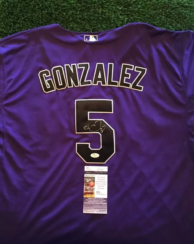 COLORADO ROCKIES CARLOS GONZALEZ SIGNED BLACK JERSEY 8X10