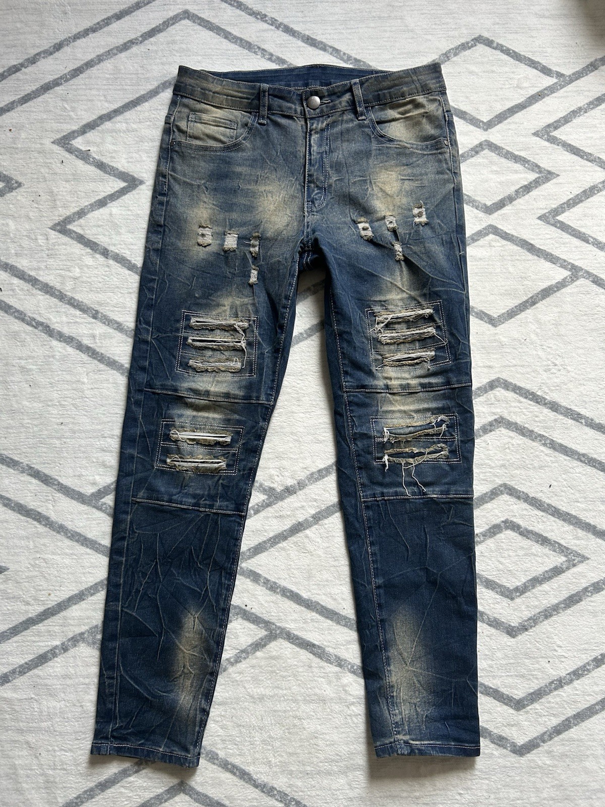 Distressed blue skinny jeans with ripped details #punkrock