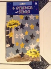Hanging Decorations - 6 Strings of Black,Silver and Gold Stars by Amscan