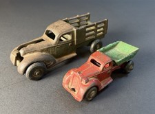 Two Vintage 1930s Arcade Cast Iron Toy Dump and Stake Trucks