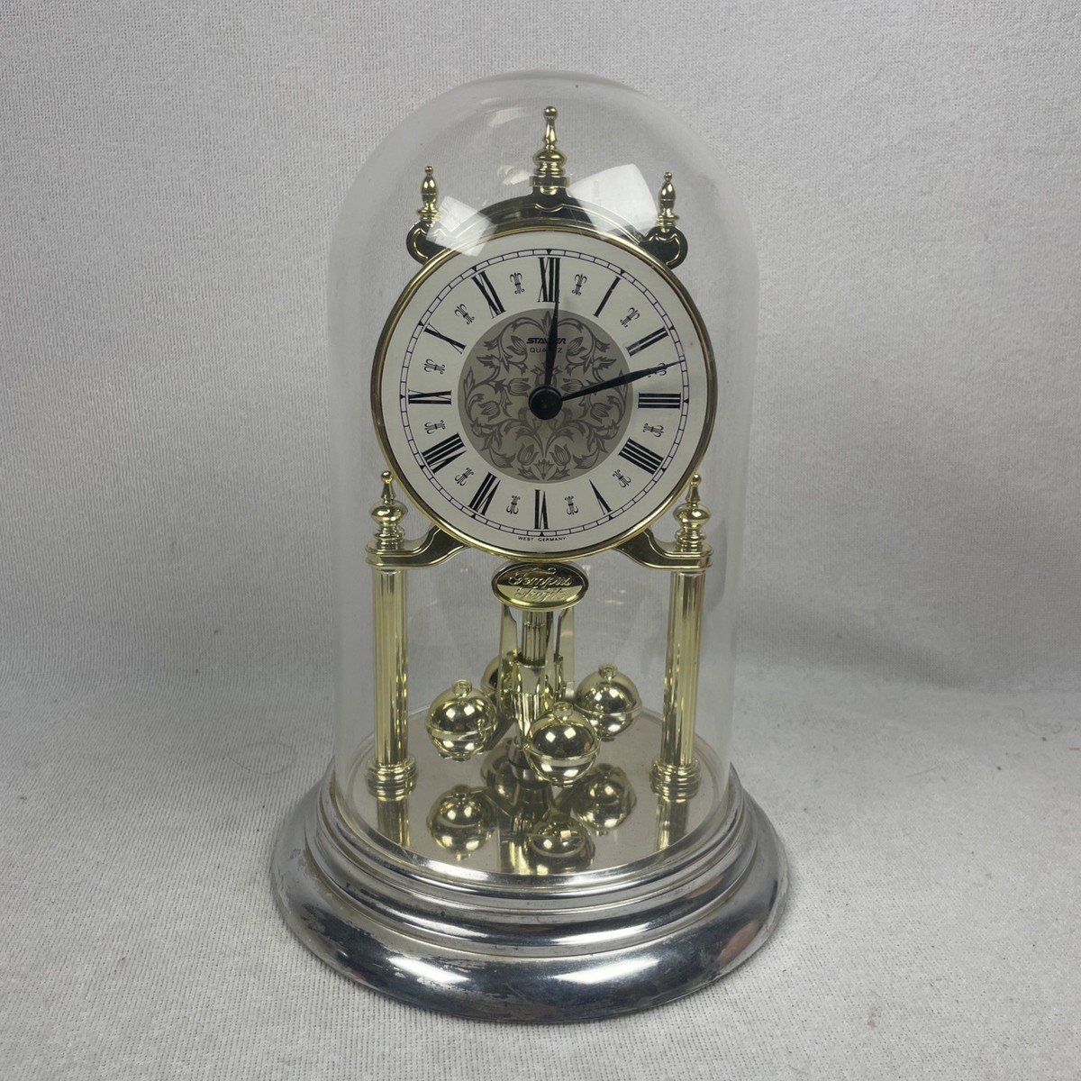 Staiger Quarts Gold Tone Spinner Clock With Glass Dome Made In