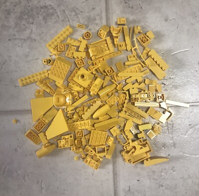 8 ounces of mixed and random yellow Lego blocks