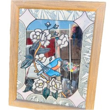 framed stained glass suncatcher featuring a floral and bird Design