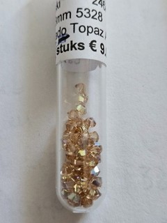 57 Swarovski Doppelkegel 3 mm Lt. Colorado Topaz AB der Fa. Nataschakralen