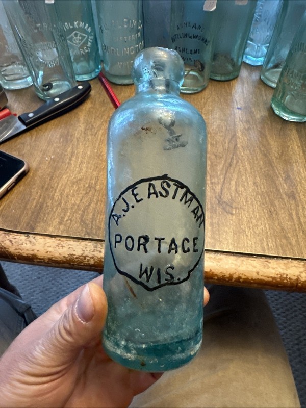 AJ EASTMAN PORTAGE WIS BLOB HUTCH SODA BOTTLE  WI WISCONSIN 