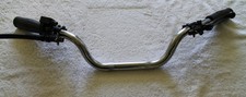 Handlebars complete with grips and levers 7/8" easy throttle.  Suit trials bikes