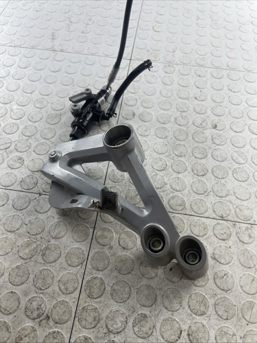 2021-2025 APRILIA RS457 FRONT RIGHT BRAKE FOOTREST BRACKET OEM (CHIPPED)