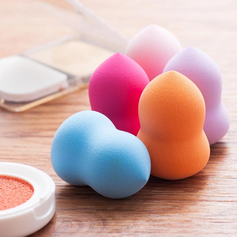 Esponja licuadora de maquillaje rosa claro caliente belleza dama diseño de botella impecable Foto 3 de 4