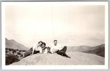 Vtg B&W Snapshot Family Group Sitting On Large Rock Mountain Background 1930s
