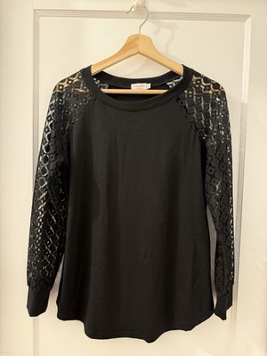 Black Woman s Stretch Knit Top With Lace Raglan Sleeve Details Medium