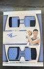 2024-25 Panini National Treasures - Rookie Materials Autographs Quad Zach...