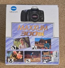 Minolta Maxxum 300Si w/AF 35-70 mm Lens, Bag, and caps. Works, But No Battery.