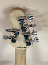 Sterling by Music Man Sub Series Axis. Maple Fingerboard. Trans Gold.