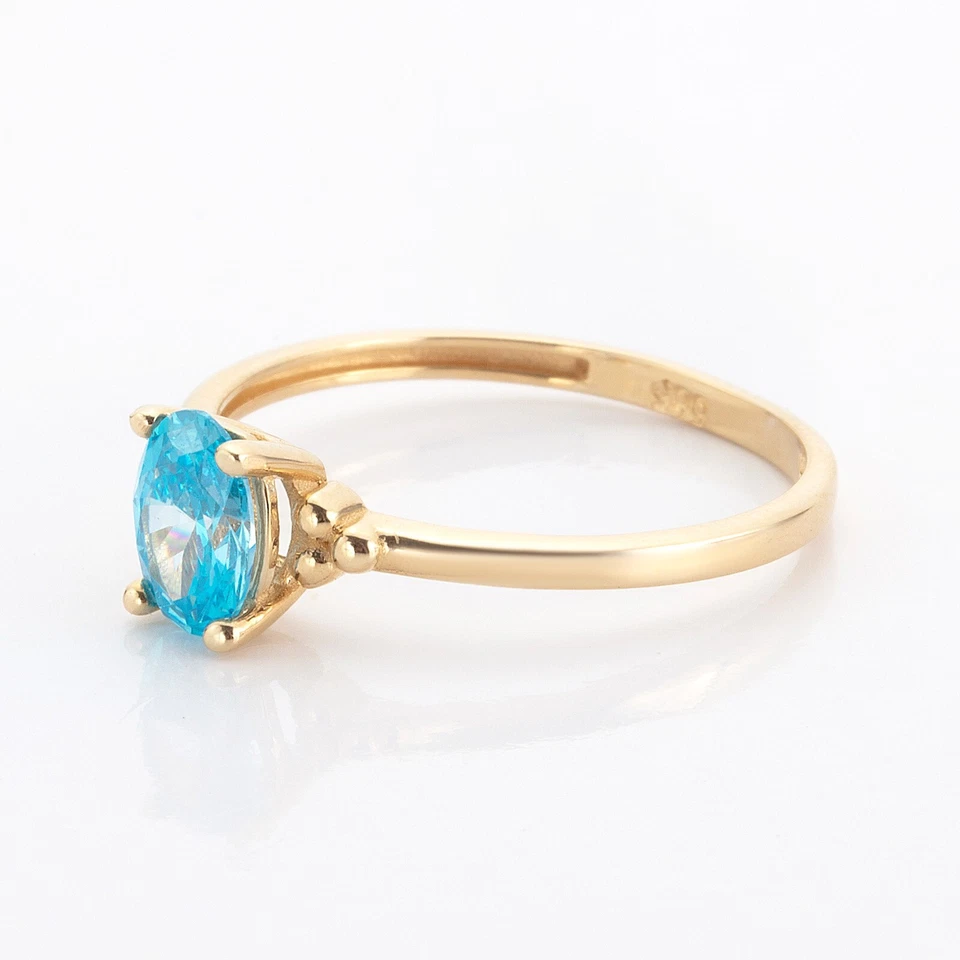 Anillo ovalado de oro amarillo de 14k con piedra aguamarina Foto 3 de 4