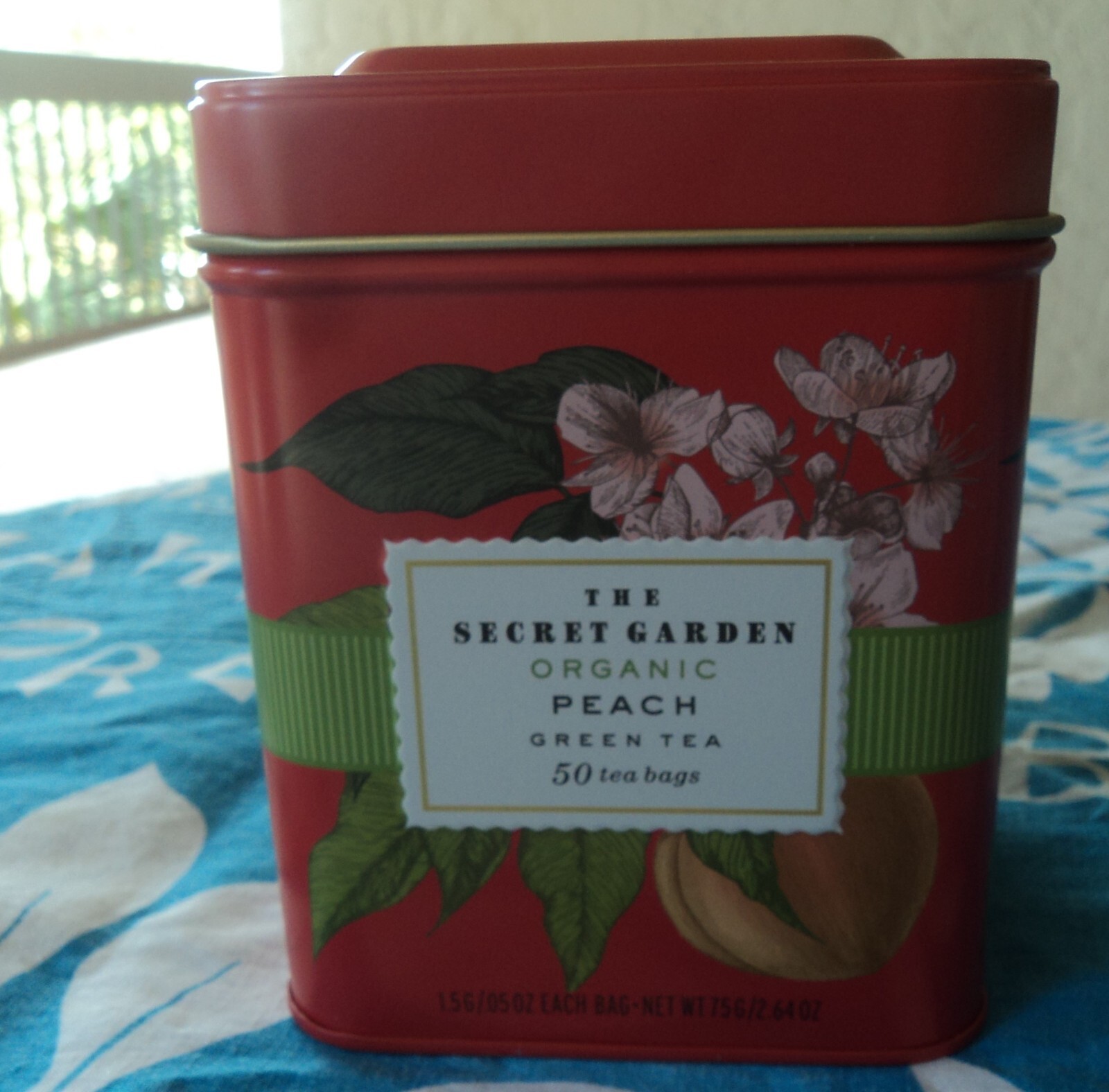 THE SECRET GARDEN ORGANIC PEACH  GREEN TEA 50 TEA BAGS IN METAL TIN.