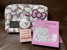 Hello Kitty cosmetic pouch with compact mirror and lip balm. NWT