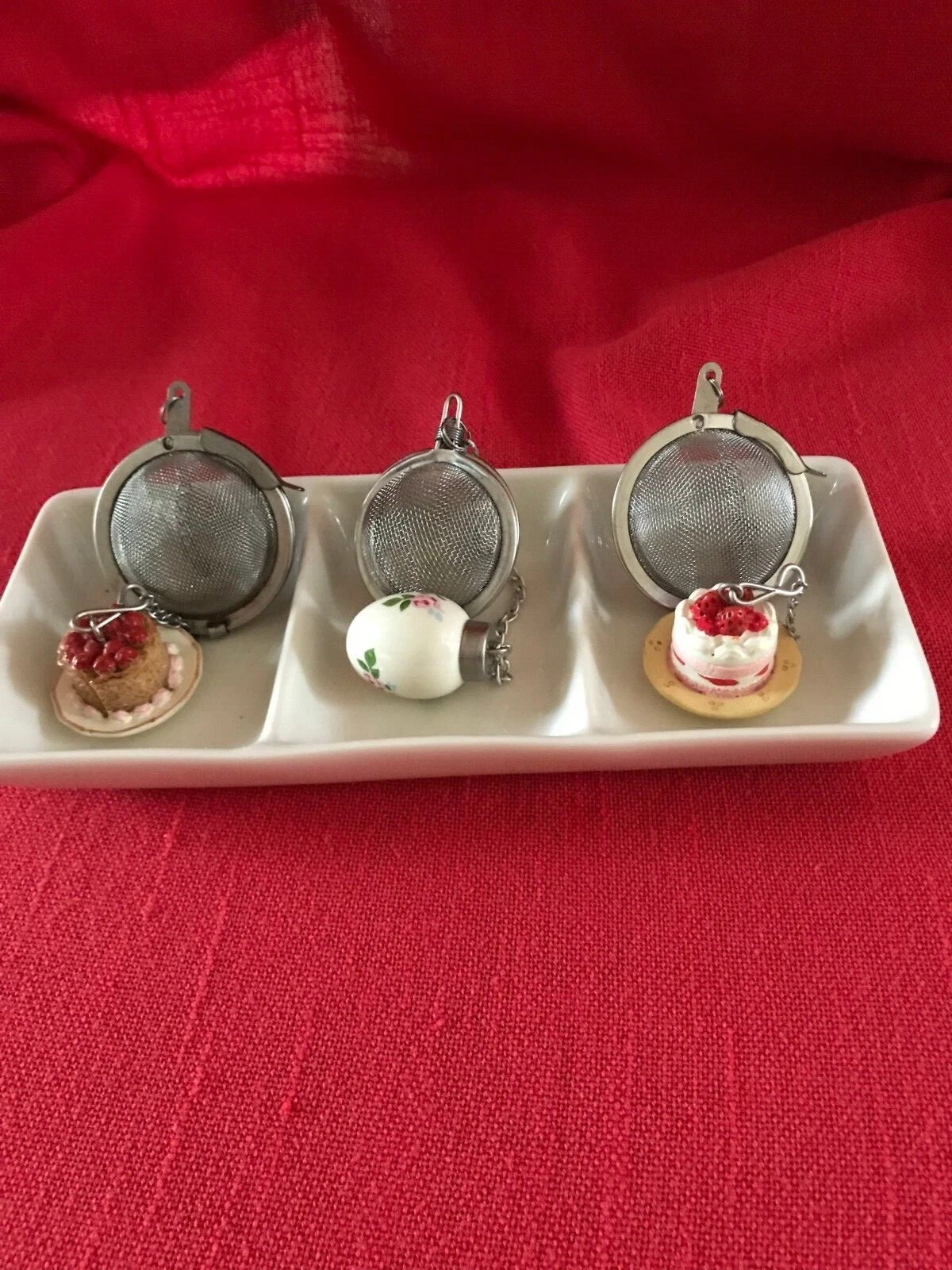 Vintage set of 3 decorative tea strainers with porcelain weights & tray