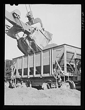 Loading seventy ton cars with iron ore. Mahoning pit, Hibbing, Minnesota