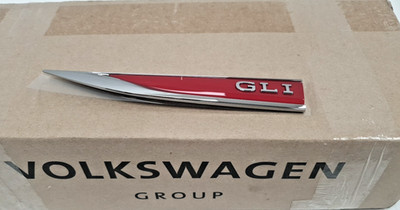 17A853689CJZQ  BRAND NEW  GENUINE VW EMBLEM ''GLI'' RED/CHROME LH JETTA  2022-2024