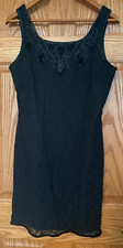 LITTLE BLACK DRESS.  MID LENGHT WITH LACE OVERLAY AND SEQUENCE