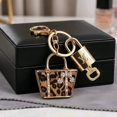 Authentic Louis Vuitton Gold Padlock with unbranded Leopard Bagcharm ,Keychain