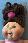 Cabbage Patch Kid Doll 2015 WCT-11K with Green Eyes Brown Hair Doll Flower Bow