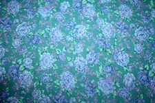 BRIGHT BLUE FLOWERS ON GREEN FROM PETER PAN  - 100%  COTTON FABRIC