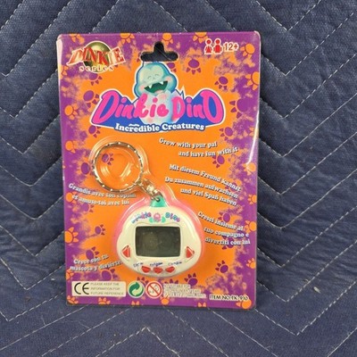 NEW Vintage Dinkie Dino Raku Raku DinoKun Virtual Pet Keychain TK-910 White