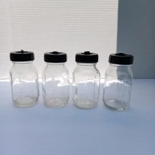 VINTAGE EVENFLO LOT BABY GLASS BOTTLES 4 Oz. W/ Caps LIDS SET OF 4 EMBOSSSED