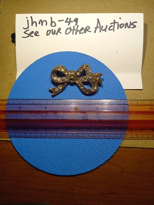 A Beautiful Bow Brooch With Accent Simulated Diamonds There Are Two Stones Missi