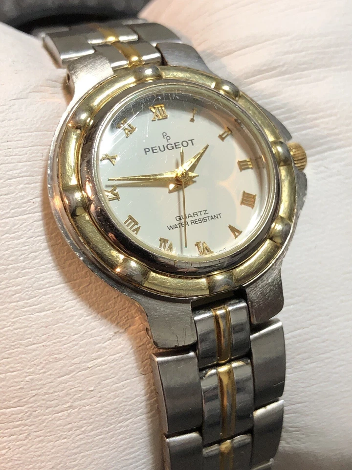 Reloj de vestir vintage Peugeot para mujer tono plata y dorado acero inoxidable número romano Foto 3 de 4