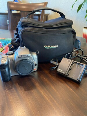 Canon EOS Rebel digital - body only.  Includes battery charger and camera bag