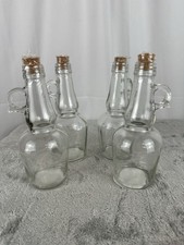 NEW Sealed Pack Of 4 Clear Glass Bottles with Round Handles and Cork Stopper
