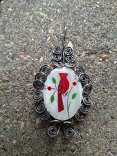 Vintage mother-of-pearl inlay and wire-wrapped pendant featuring a red cardinal