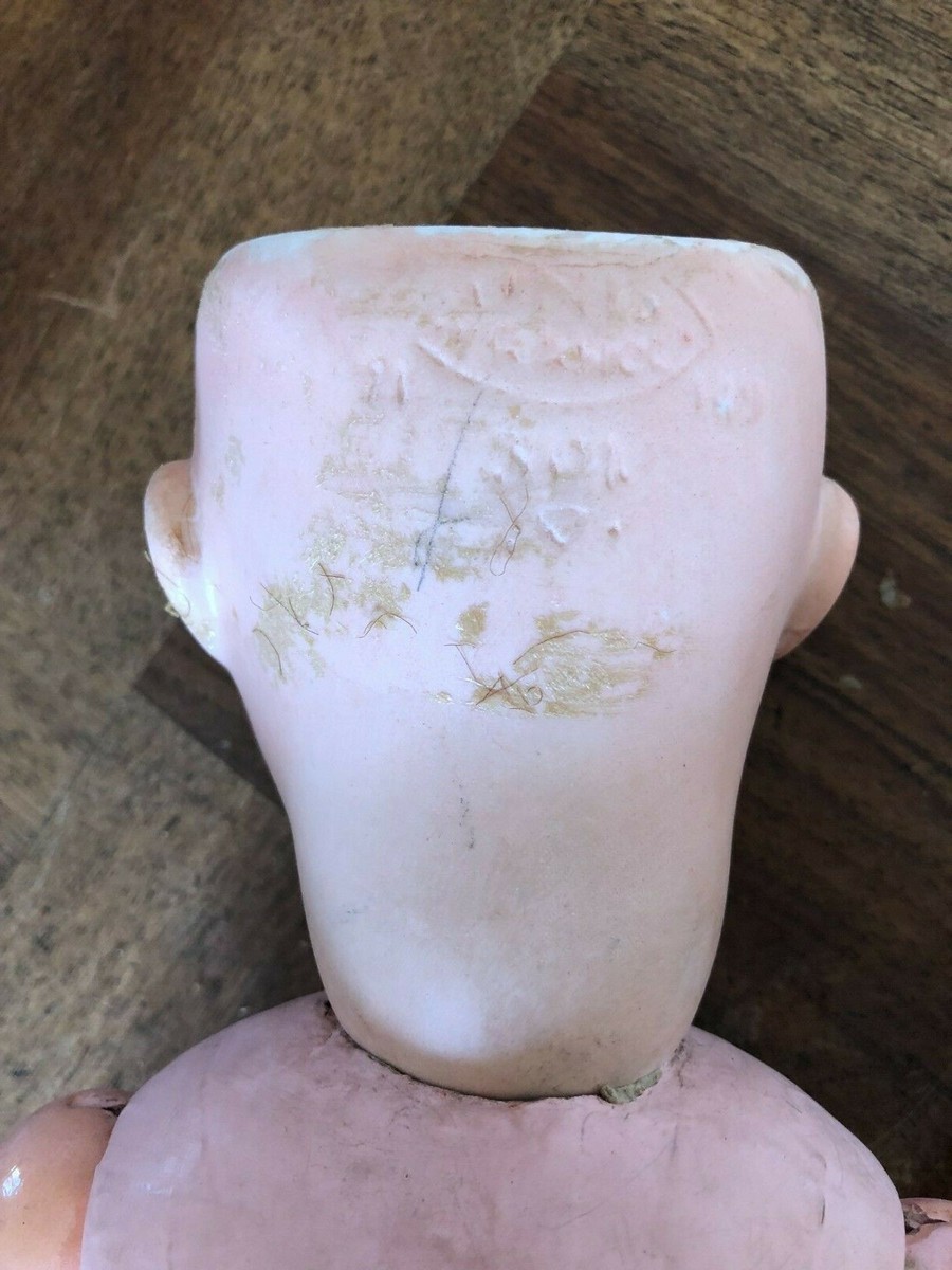 POUPEE TETE PORCELAINE BOUCHE OUVERTE (LES YEUX TOMBES A L'INTERIEUR DE