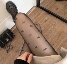 Sheer Black Bow Pattern Tights – Elegant & Trendy