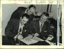 1967 Press Photo Baseball star Lou Boudreau signs a note with two others