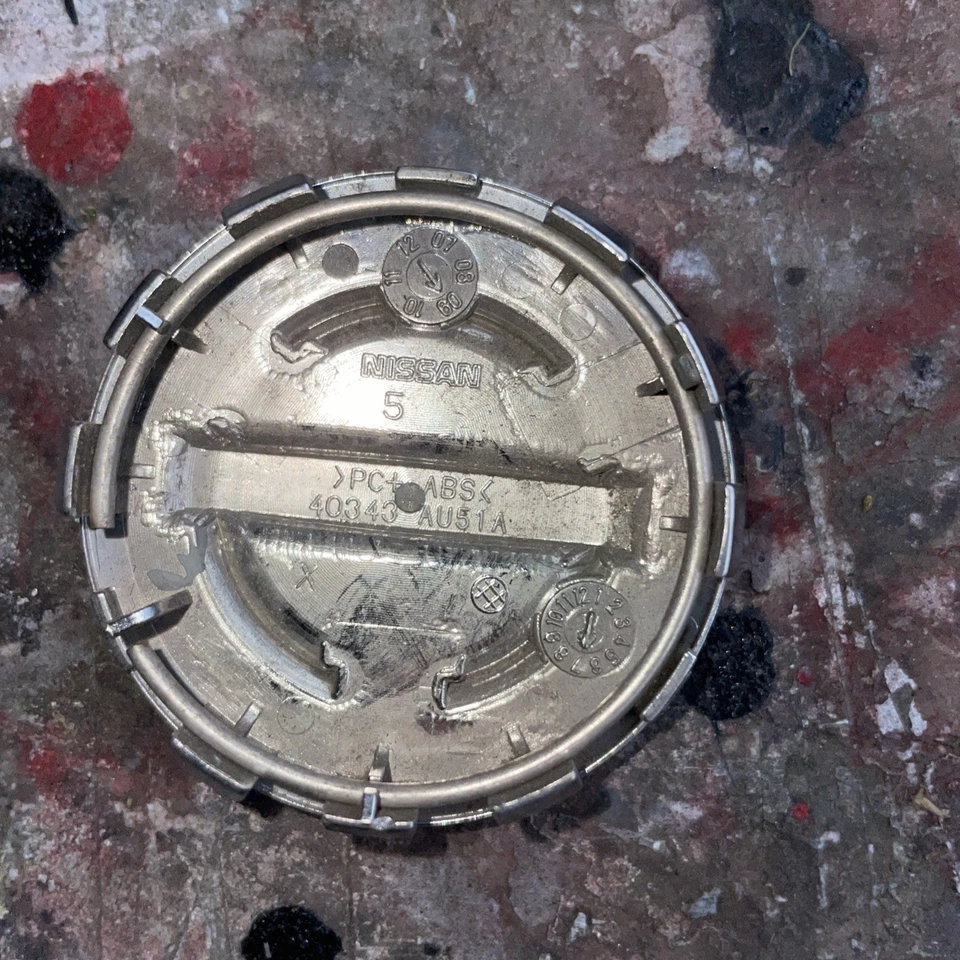 TAPA CENTRAL RUEDA NISSAN MURANO, QUEST, ROGUE, SENTRA, VERSA 40343-AU51A Foto 4 de 4