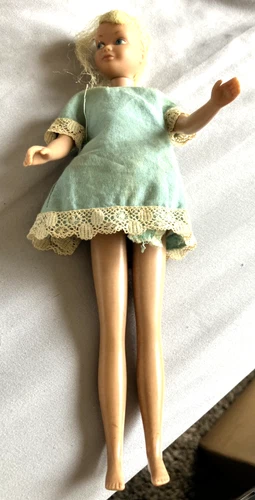 1963 Skipper 9" Doll with original dress, from Mattel, Missing some hair