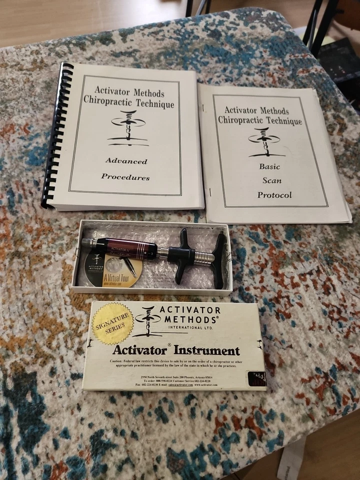 Instrumento Quiropráctico Activator IV con Herramienta de Ajuste de Caja y Tectbooks Foto 2 de 3