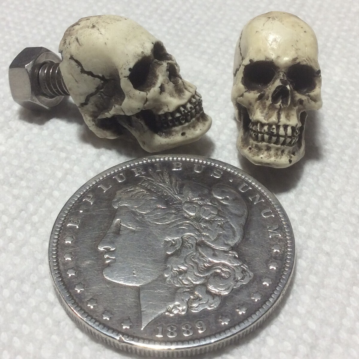 Set Of 2 Skull License Plate Bolts - 1/2 Skull Design, Antiqued Bone Finish, Made In USA 8 thumbnail image