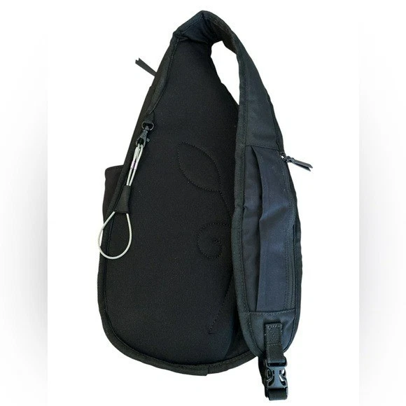 Bolso bandolera de viaje Sherpani Esprit At antirrobo en negro y naranja Foto 2 de 4